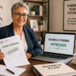 Senior entrepreneur reviewing approved small business grant documents